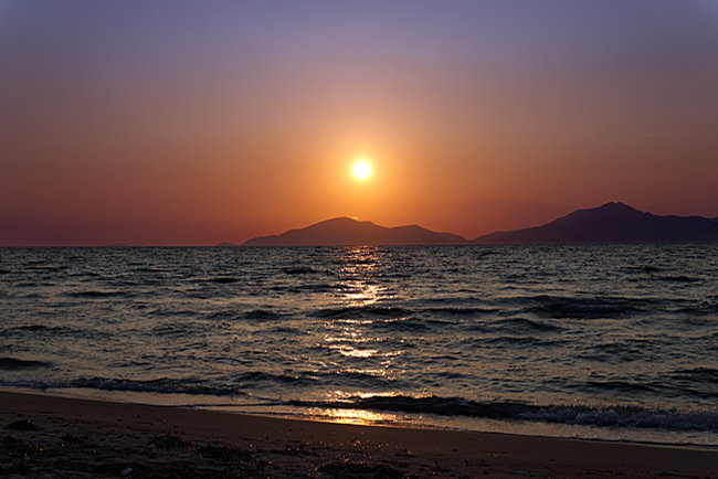 Kos in Greece - Sunset over Kalymmos viewed from Marmari beach; no camera can truly capture the atmosphere