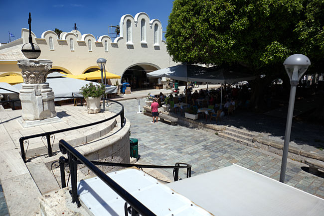 Kos Town in Greece - View of the Market Hall with outdoor restaurant tables