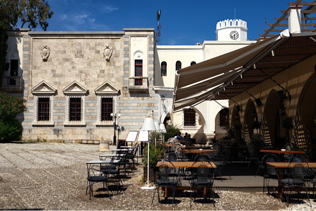 Kos Town in Greece - The back of the Palazzo di Giustizia featuring a restaurant adjacent to the Agorá