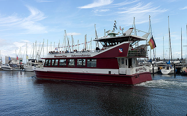 Rostock - Warnemünde - More than just harbor tours—when a cruise ship arrives or departs, accompanying trips are offered. This allows those on board to get very close to the larger ships.