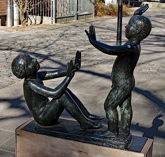 Rostock - Bronze sculpture Playing Children by Lore Plietzsch (1979) near St. Mary's Church