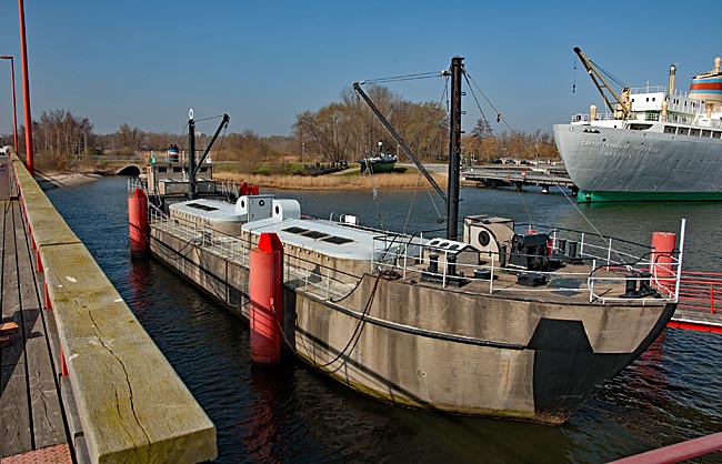 Rostock - IGA PArk - Concrete ship CAPELLA, with the stern of the traditional ship in the background